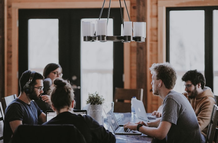 People reviewing documents together around a table